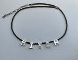 That B necklace