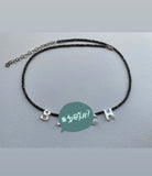 That B necklace