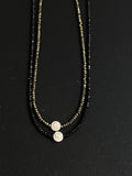 Small evil eye talisman. Eye of Naxos. Shiva shell with black spinel