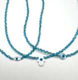 Evil eye mother of pearl hamsa shape and blue gemstone necklace