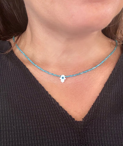 Evil eye mother of pearl hamsa shape and blue gemstone necklace