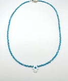 Evil eye mother of pearl hamsa shape and blue gemstone necklace