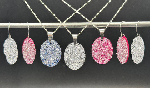 Jewelry set with pendants and earrings on a dark background