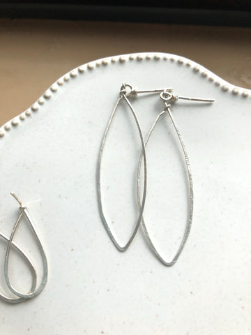 Silver hammered marquise shaped earrings.