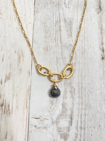 necklace matte gold on triple link. Black spinel